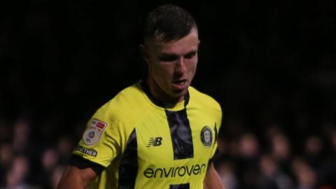 Jack Muldoon playing for League Two side Harrogate Town