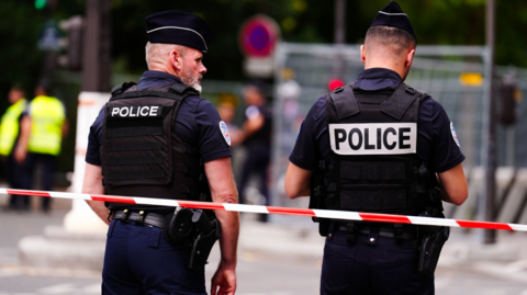 Perimeter fencing is patrolled by Police near the River Seine, Paris