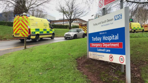 Ambulance and fire engines arrive at Torbay Hospital following the collision with a portacabin. A large blue and white sign states: Welcome to Torbay Hospital Emergency Department Cadewell Lane