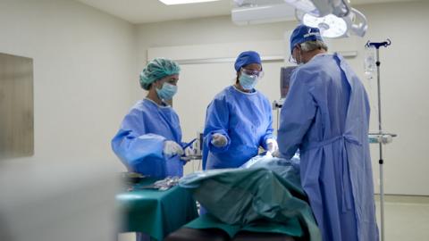 Surgeons operating