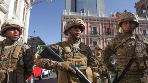 Armed troops stand outside the Bolivian government building in La Paz