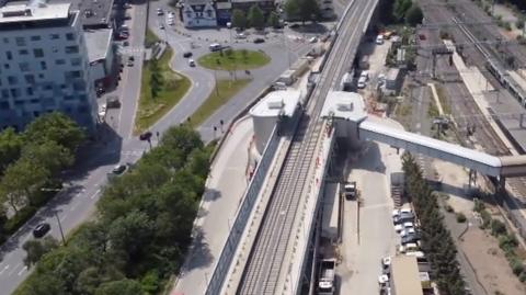 Aerial video shows new station platforms and tracks along a 21-mile (33km) section of railway.