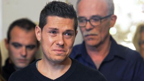 In this file photo taken on November 2, 2017 relatives of murdered French woman Alexia Daval, her husband Jonathan Daval (c), father Jean-PIerre Fouillot (r) give a press conference at the Town Hall in Gray, eastern France.