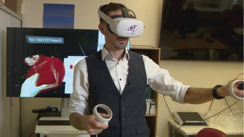 David Howie practices surgery using the VR headset