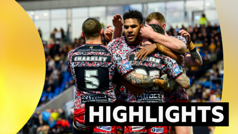 Leigh players celebrate a try at York