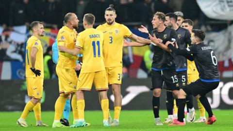 Romania and Kosovo players argue