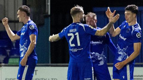 Penybont's Gabe Kircough celebrates with team mates after scoring his side's second goal
