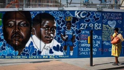 Mural of Kevin Clarke at various ages against a blue background