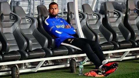 Robert Sanchez sat on the bench with his arms folded at a training session