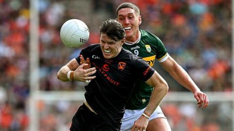 Armagh's Joe McElroy is challenged by Kerry's Joe O'Connor during the 2025 All-Ireland quarter-final