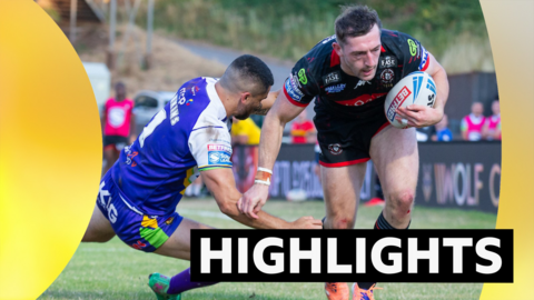 Jake Wardle of Wigan scores a try against Bradford