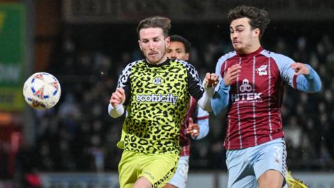 Forest Green Rovers midfielder Kyle McAllister (7) battles for the ball during the Enterprise National League match between Scunthorpe United and Forest Green Rovers at the Sands Venue Stadium, Scunthorpe