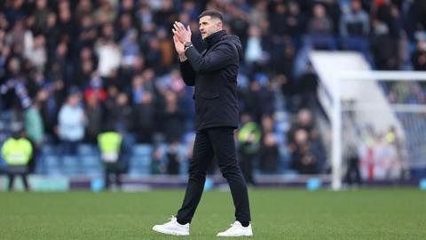 Portsmouth boss John Mousinho claps the Pompey fans