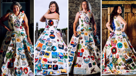 A composition image of four different modelling the Portland Dress. The dress itself is a white calico floor length dress with a v neck tank top style and blue ribbon laced on the back like a corset. It is covered in different colours emboirdery patches. From left to right, Hazel Smith has grey hair styled in a short bob, she is smiling at the camera and has one arm relaxed by her side while the other hand rests on her hip. Annerose Walker is smiling at the camera with her hands lifted up to the side of her face. She has shoulder length dark brown hair which is windswept away from her face. Sarah Partridge stands confidently with her arms by her sides and looks at the camera. She has long blonde curly hair. Poppy Hardwicke has her back to the camera, looking back over her shoulder and smiling. She has her hands on her hips and long dark brown hair.