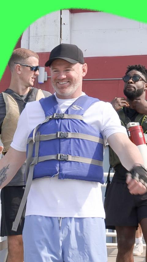 Wayne Rooney, Joe Hart and Micah Richards in lifejackets, on a jetty