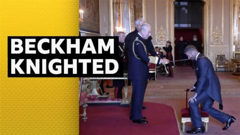 Sir David Beckham being knighted by King Charles