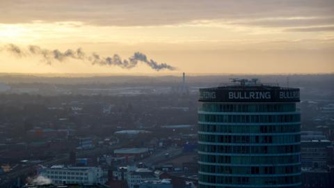 Birmingham skyline with the Rotunda building in the foreground that says Bullring.