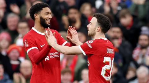 Joe Gomez and Diogo Jota celebrate a goal