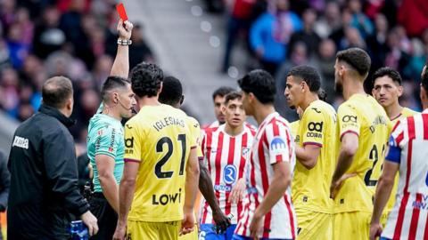 Abdel Abqar is shown a red card 
