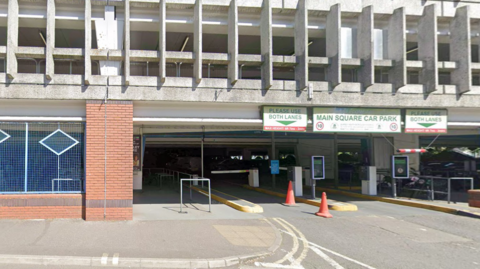 The entrance to Main Square car park in Camberley, a large multi-storey building, with the name of the car park above it.