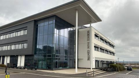 Office Building with science park written veritically on the entrance wall