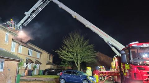 Fire crews tackling fire in house roof