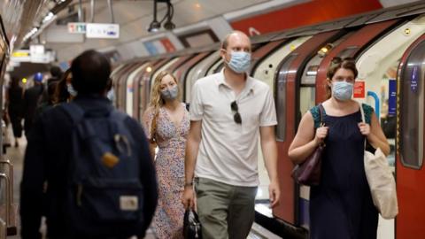 commuters with masks