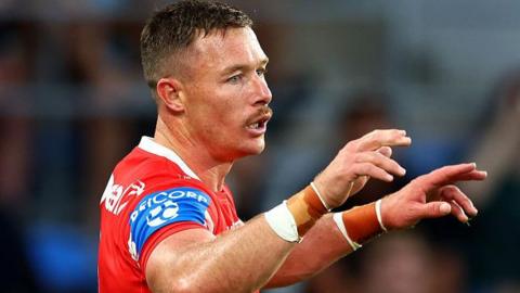 Damien Cook gives instructions to his St George Illawarra Dragons team-mates.
