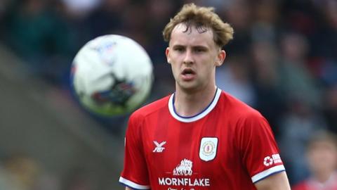 Zac Williams watches the ball carefully during a game for Crewe