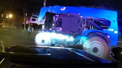 Forklift as seen from police car dashboard