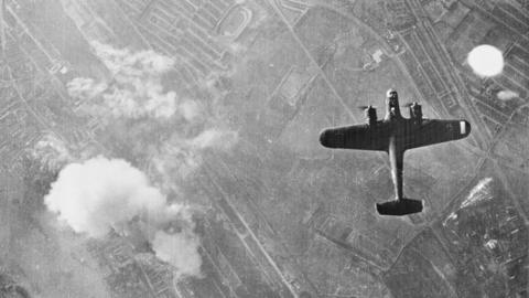 A black and white image of German bombers flying overhead in the UK.