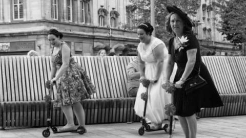 A bride Scooting through the city centre