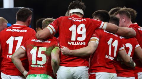 Wales players in a huddle
