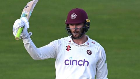 Rob Keogh raises his bat