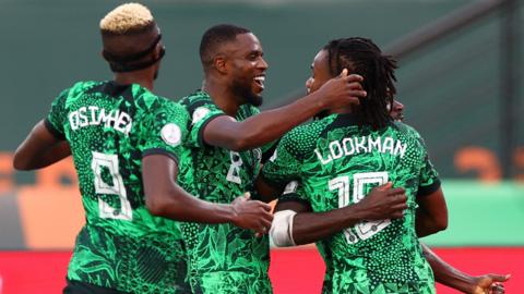 Nigeria celebrate a goal against Angola