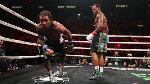 Gervonta Davis gets back up after taking a knee with Lamont Roach Jr looking on confused