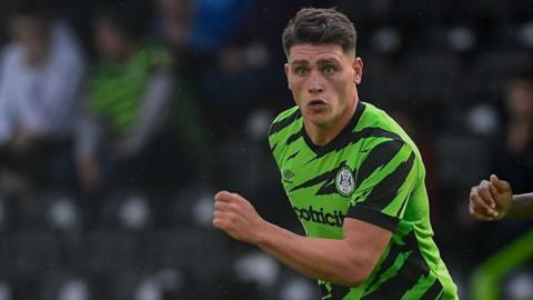 Matty Stevens runs for the ball for Forest Green