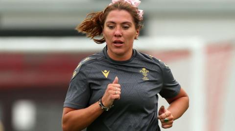 Georgia Evans doing bronco runs inside Wales' training barn