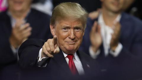 President Donald Trump gestures during his Make America Great Again Rally at the Florida State Fair Grounds Expo Hall in Tampa, Florida, on 31 July 2018