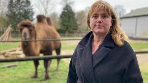 Claudia Roberts and a camel in the background