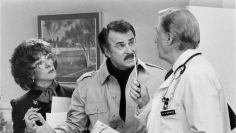 Mr Coleman as Ron Carlisle in Tootsie, in a scene with Dustin Hoffman and George Gaynes