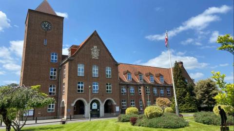 Exterior shot of Spelthorne Borough Council offices in Staines on a sunny day