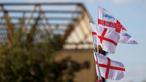 Three England flags in the air