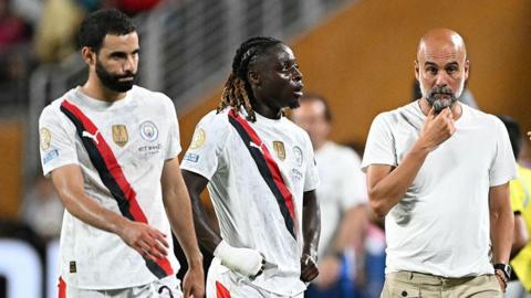 Rayan Ait-Nouri, Jeremy Doku and Pep Guardiola look dejected