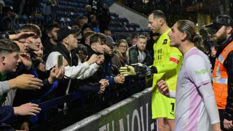 Goalkeeper Conor Hazard and striker Lorent Tolaj speak with Argyle fans after the 2-0 FA Cup loss at Wycombe last week