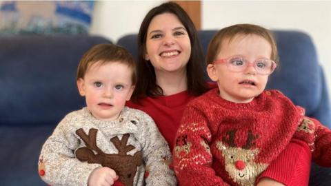 Sarah with twins Iris (left) and Astrid