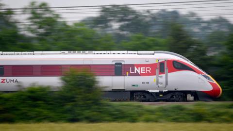 A stock image of a moving LNER training pictured on tracks in the countryside