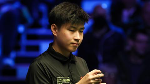 China's Zhao Xintong during 2022 Cazoo Champion of Champions match against Ronnie O'Sullivan