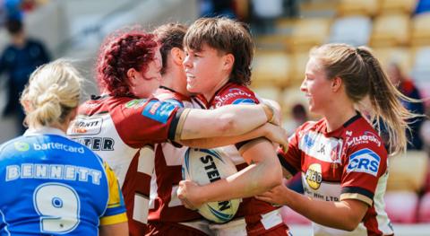 Molly Jones celebrates her try for Wigan against Leeds