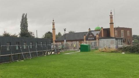 The outside of the mosque with the building work already taking place